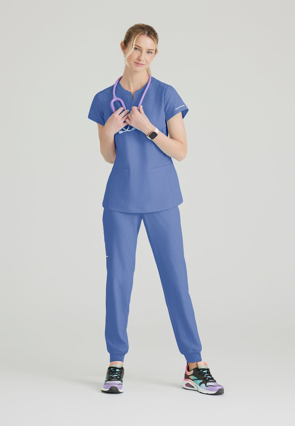 SKT259 - Skechers Women's Coast 2-Pocket Banded Collar Top