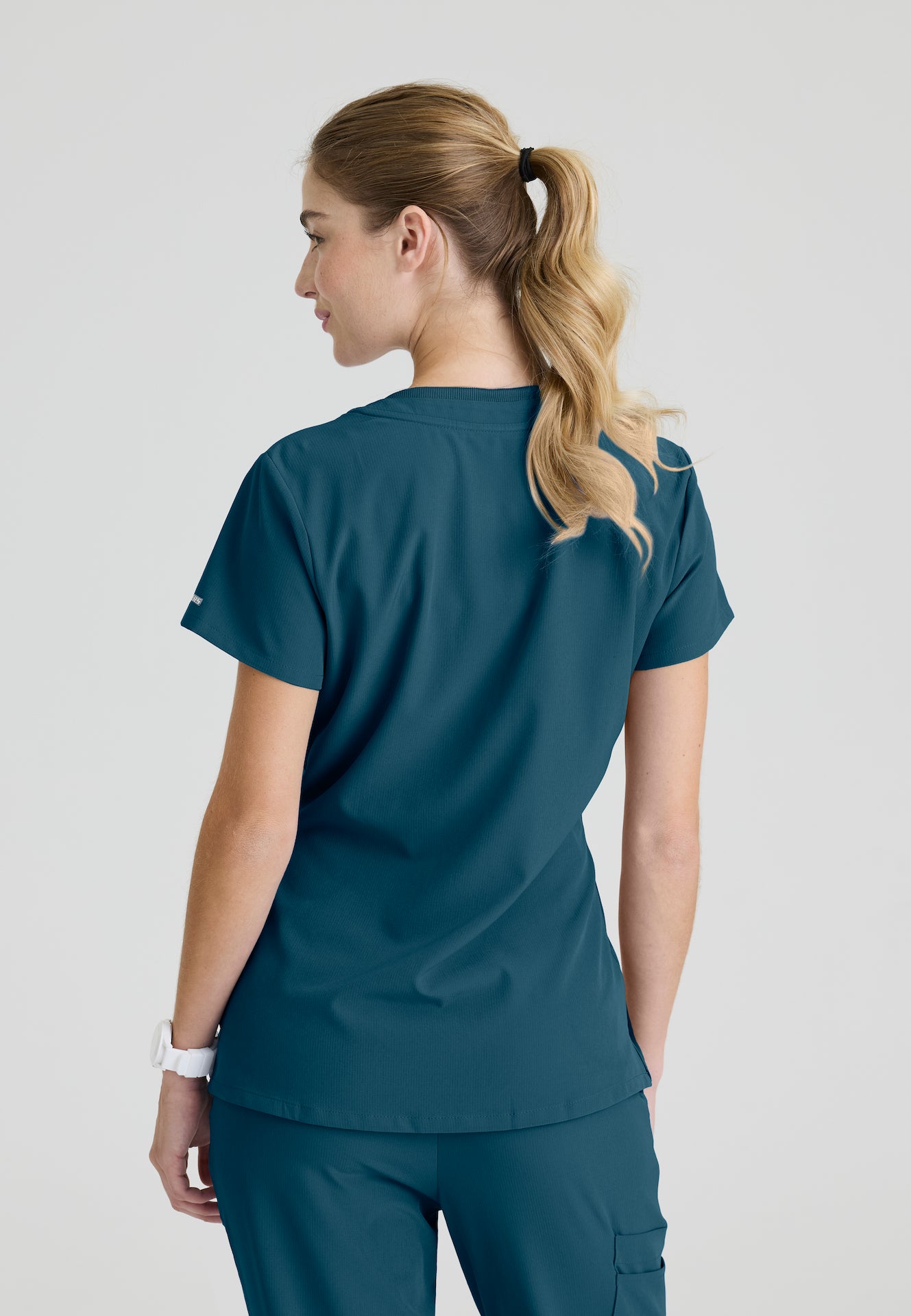 SKT147 - Skechers Women's Single Pocket V-Neck Tuck In Top